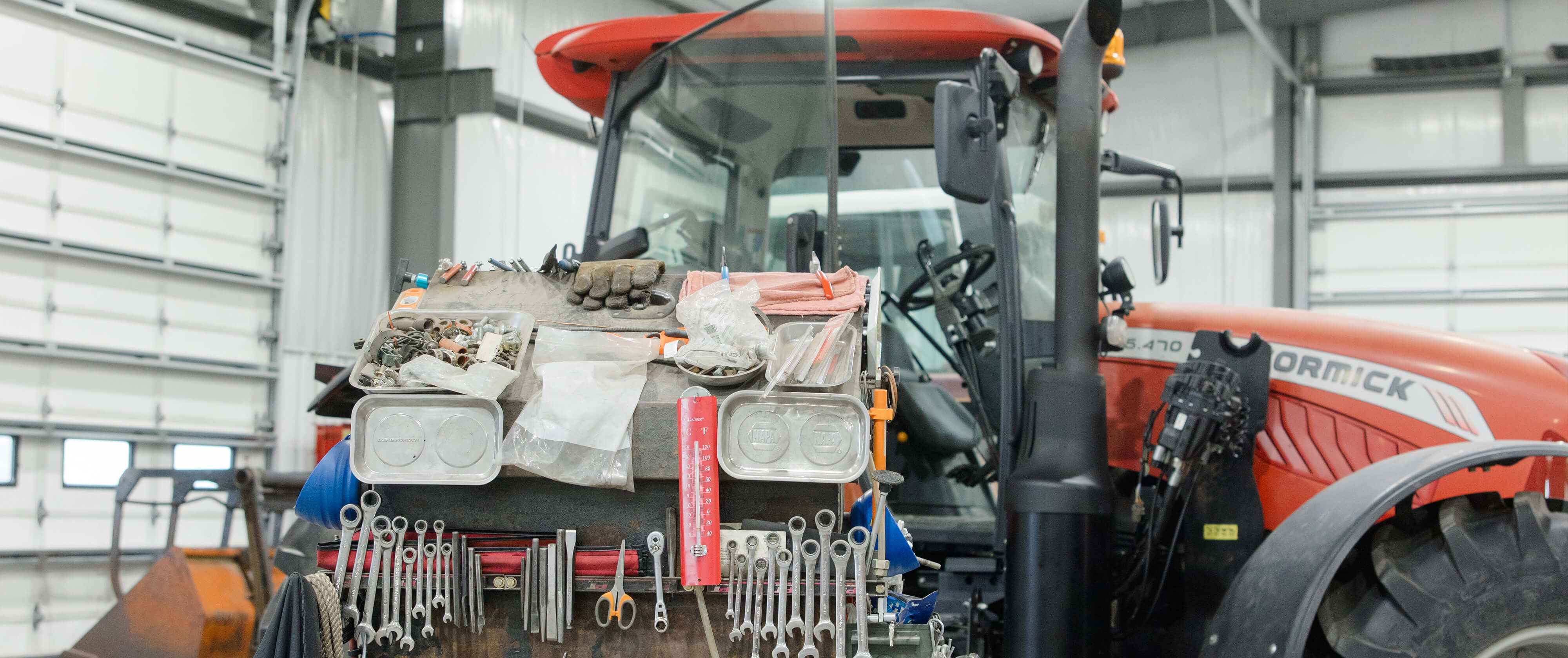 Red tractor in our service building